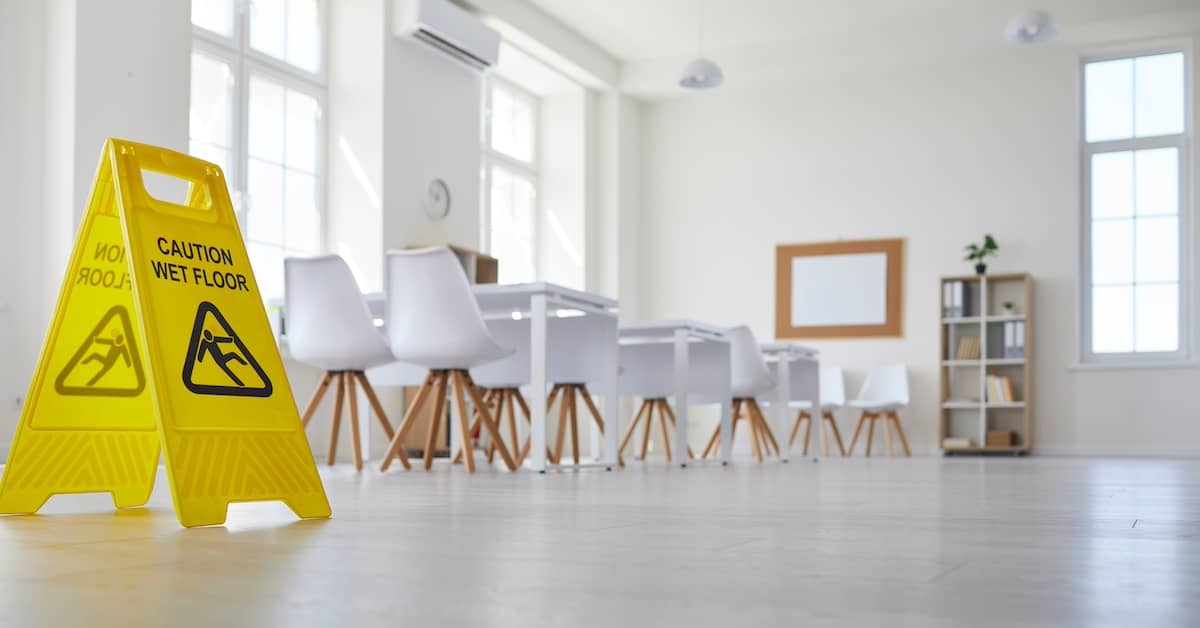 Caution: Wet Floor sign in a commercial office space | Colombo Law